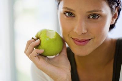 woman holding an apple