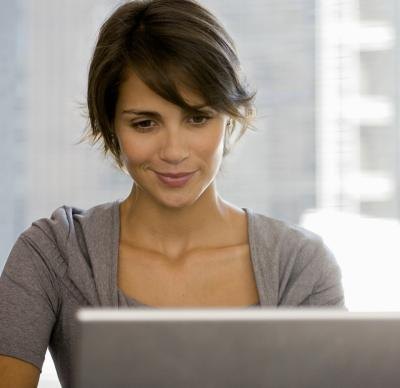 Woman smiling on laptop
