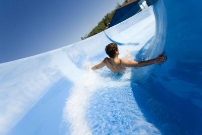 Man riding on water slide