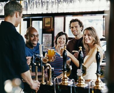 Group of friends drinking at a bar.