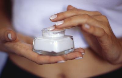 Woman with cream treatment