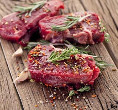 Raw filet mignon with herbs and spices