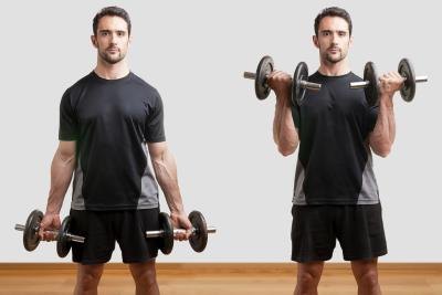 A man performs a standing bicep curl.