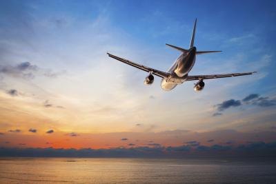 Airplane flying over water