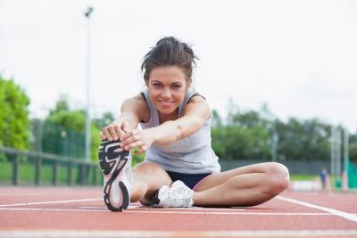 Woman stretches before exercising