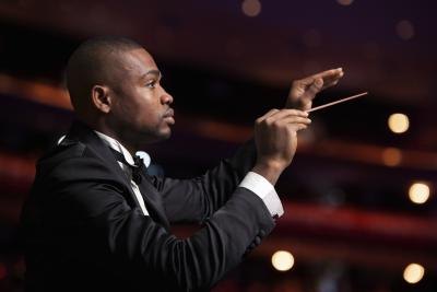 Conductor leading an orchestra
