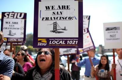 Members of a healthcare union ralley together.