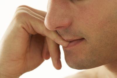 Anxious man biting fingernails. Anxious man biting fingernails.