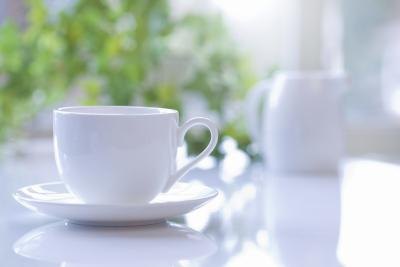 Coffee cup on table.