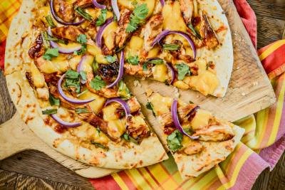 Pizza with chicken, cheese, red onions and cilantro