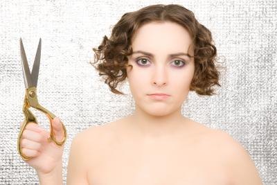 Woman with scissors to cut hair.