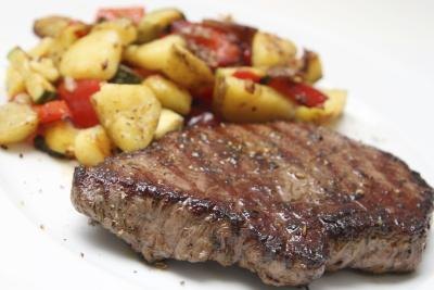 Barbecue with meat and potatoes