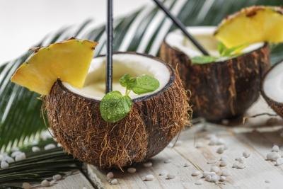 Close-up of two cocktails served in coconut shells