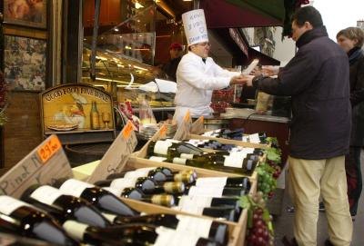 People buy crepes from street chef in Paris, France
