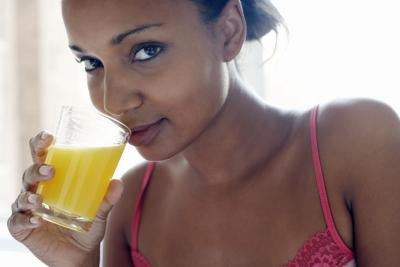 woman drinking pineapple juice