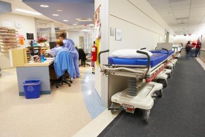 Hospital desk with staff and gurney's