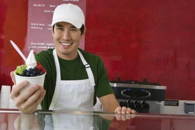 man handing over ice cream