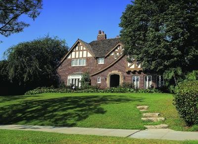 Match modern colors of brick with the bold colors available in roofing materials.