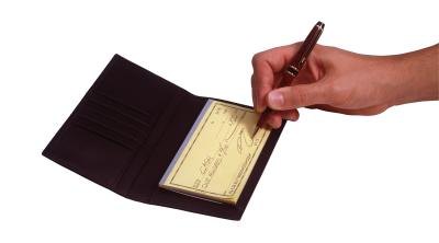 Writing a personal check.