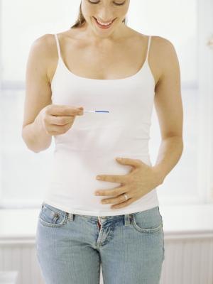 Woman with pregnancy test