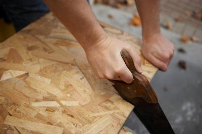 Man sawing wood