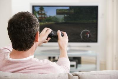Man playing video games at home
