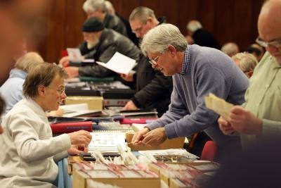 Stamps being examined at booth
