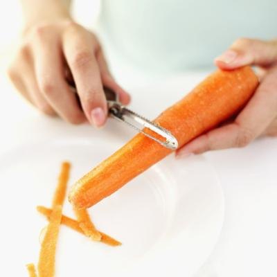 Woman preparing a carrot