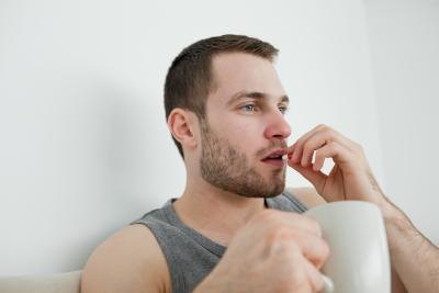male taking a pill
