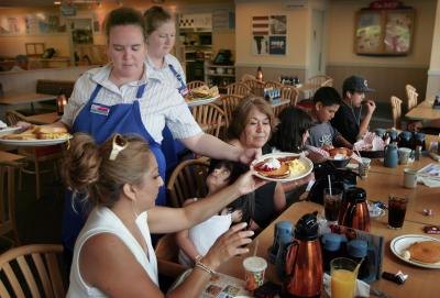 Waitress serving guests