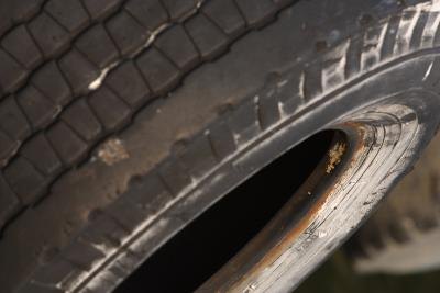 Old tire showing uneven wear on tread
