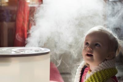 Young child next to humidifier