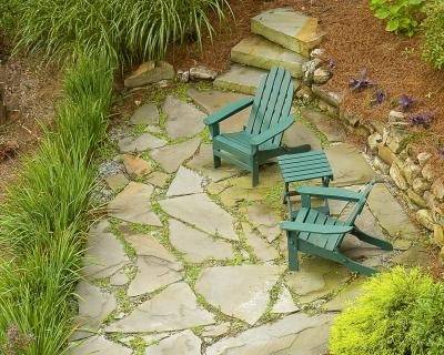natural stone patio and small chairs