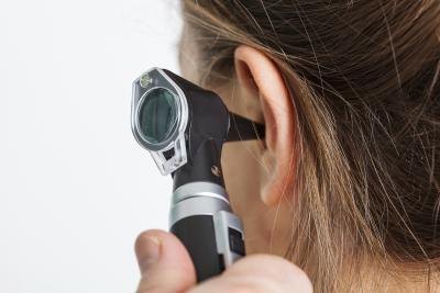 An otoscope is used by a doctor to examine the ear.