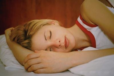 A woman sleep on her arm.