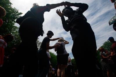 People swing dancing outdoors