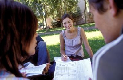 Group of people studying together outdoors.