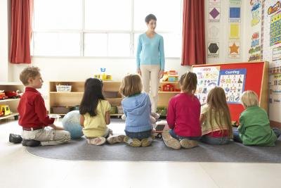 Students sitting with their teacher.