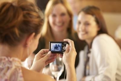 Woman taking photo on digital camera
