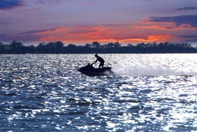 Man riding jed ski in open ocean water