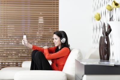 A woman listening to music and relaxing at home A woman listening to music and relaxing at home