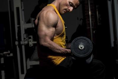 Man lifting weights at the gym. Man lifting weights at the gym.