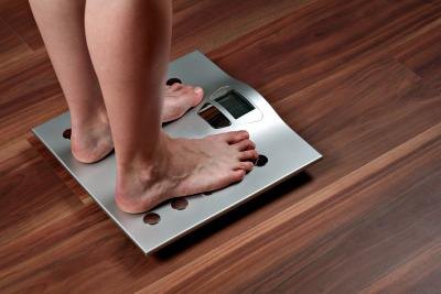 Weigh yourself without your clothes when you wake up.