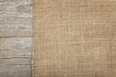 Burlap material on a wood surface.