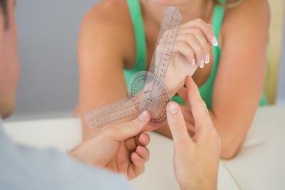 Doctor examining woman's bone structure