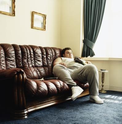 Overweight man on sofa Overweight man on sofa