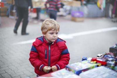 child at outdoor flea market