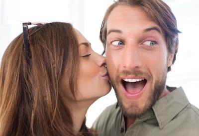 surprise him with a kiss