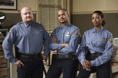 3 public police officers inside police station. 3 public police officers inside police station.