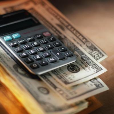 Calculator on top of US dollars.
